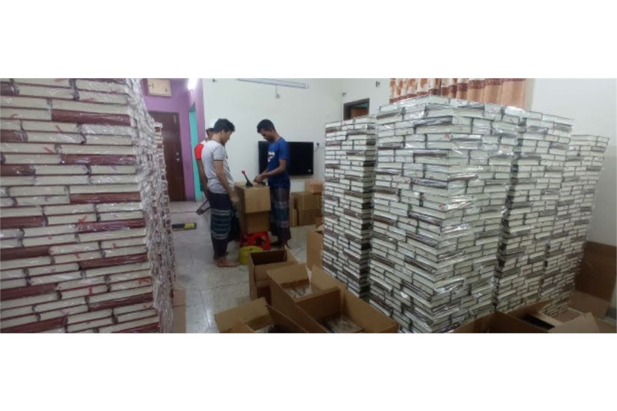 Packing Mushafs into cartons for shipment